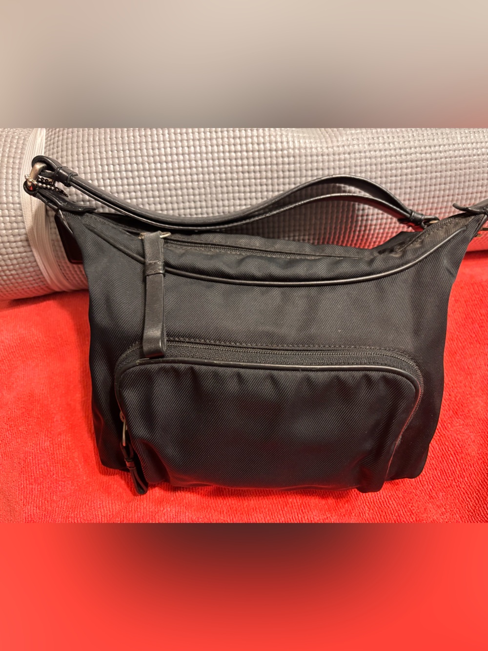 Black women’s Coach nylon with leather trim  Bag with Front Zip Pocket